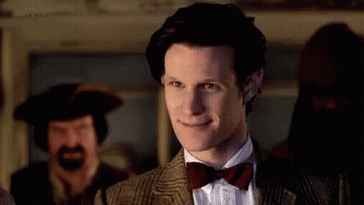 Man In Suit And Bow Tie Smiling GIF