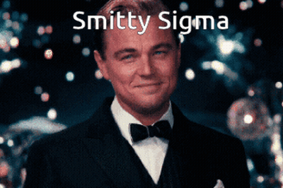 Man In Suit And Bow Tie Smiling With Smitten Sigma GIF