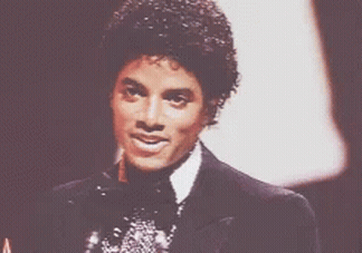 Man In Suit And Bow Tie Smiling GIF