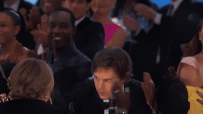 Man In Suit And Bow Tie Standing Before Crowd GIF