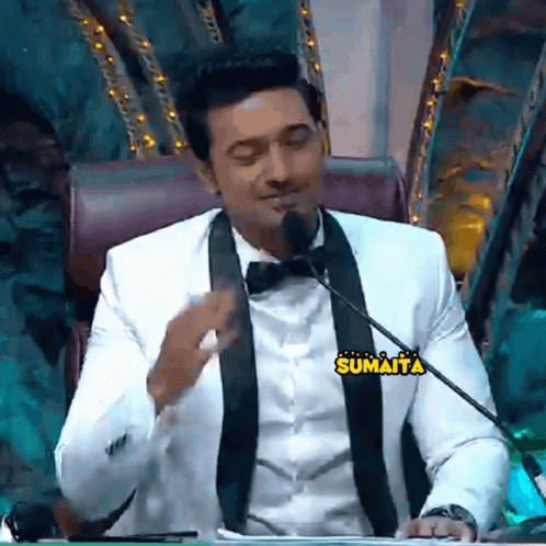 Man in Suit and Bow Tie With Sumaita Sticker