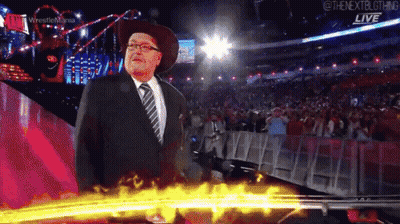 Man In Suit And Cowboy Hat At Wrestlemania GIF