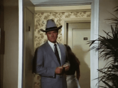 Man In Suit And Cowboy Hat Walking GIF