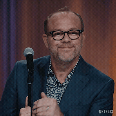 Man In Suit And Glasses At Microphone Netflix GIF