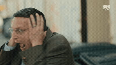 Man In Suit And Glasses Covering Head GIF