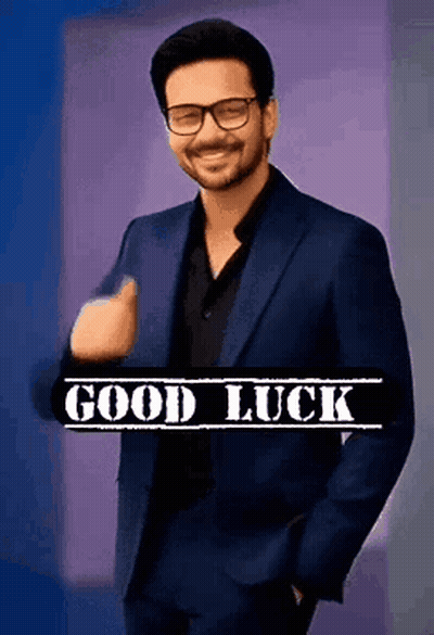 Man In Suit And Glasses Giving Thumbs Up Saying Good Luck GIF
