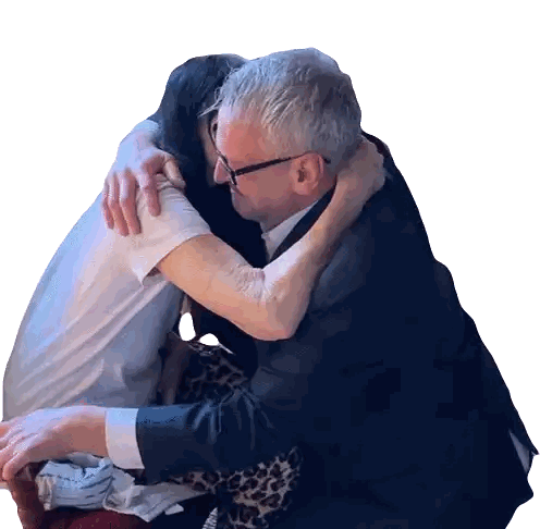Man In Suit And Glasses Hugging Woman Sticker