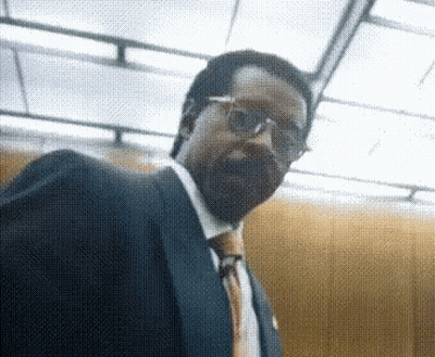 Man In Suit And Glasses Looking GIF