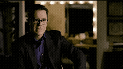 Man In Suit And Glasses Making A Face GIF