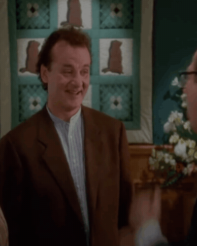 Man In Suit And Glasses Next To Man In Suit GIF
