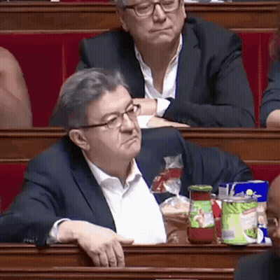 Man In Suit And Glasses Sitting In Classroom With Tomato Sauce GIF