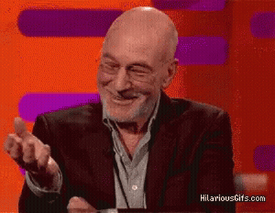 Man In Suit And Glasses Smiling Hilariousgifs GIF