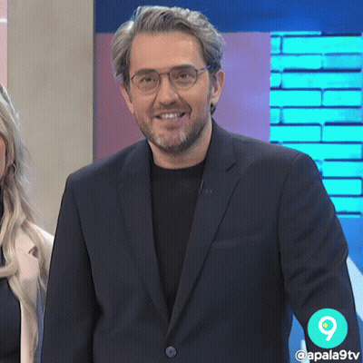 Man In Suit And Glasses Smiling With Number 9 GIF