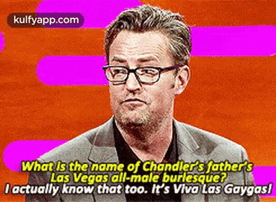 Man In Suit And Glasses Talking About Chandler's Father GIF