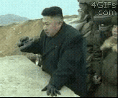 Man In Suit And Gloves On Dirt Road GIF