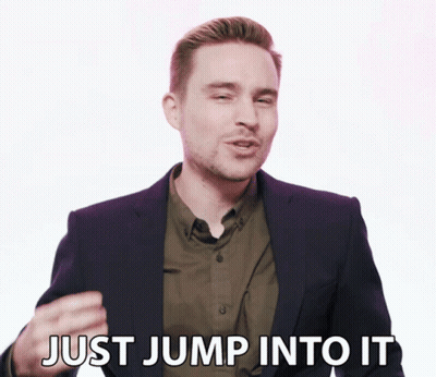 Man In Suit And Green Shirt Says Just Jump Into It GIF