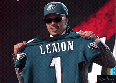 Man In Suit And Hat Holding Lemon Jersey GIF