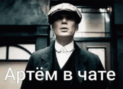 Man In Suit And Hat In Front Of Russian Building GIF
