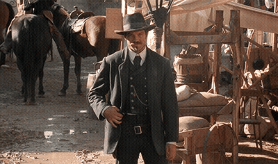 Man In Suit And Hat In Muddy Area GIF