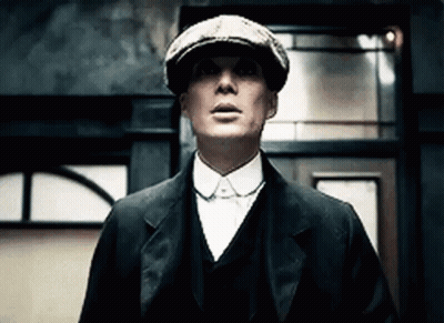 Man In Suit And Hat Looking Up At Building GIF