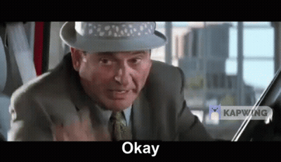 Man In Suit And Hat Making Funny Face GIF