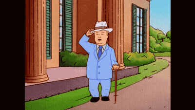 Man In Suit And Hat Saluting In Front Of Building GIF