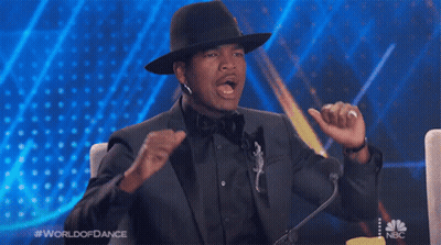 Man In Suit And Hat Speaking Into Microphone World Of Dance GIF