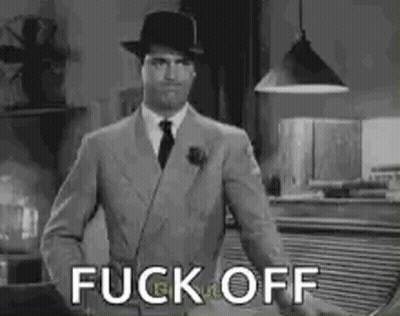 Man In Suit And Hat Standing GIF