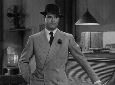 Man In Suit And Hat Standing GIF