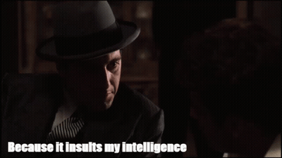 Man In Suit And Hat Talking To Another Man Saying Because It Insults My Intelligence GIF