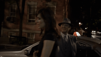 Man In Suit And Hat Talking To Woman GIF