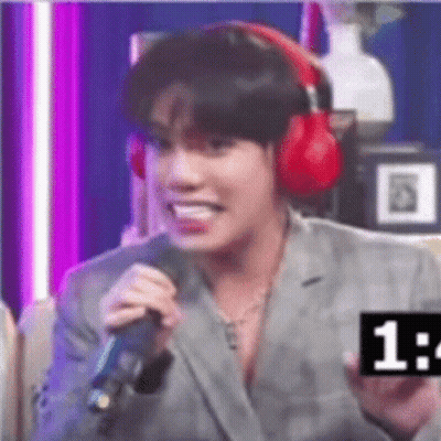 Man In Suit And Headphones Holding Microphone GIF