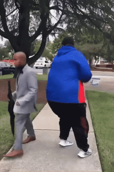 Man In Suit And Man In Blue Jacket Walking GIF