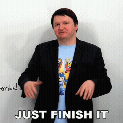 Man In Suit And Mega Man Shirt Says Just Finish It GIF