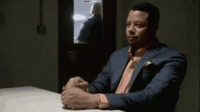 Man In Suit And Pink Shirt Sitting At Table Hands Folded GIF