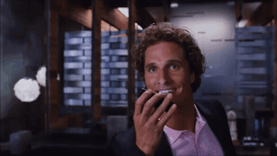 Man In Suit And Pink Shirt Talking On Cell Phone GIF
