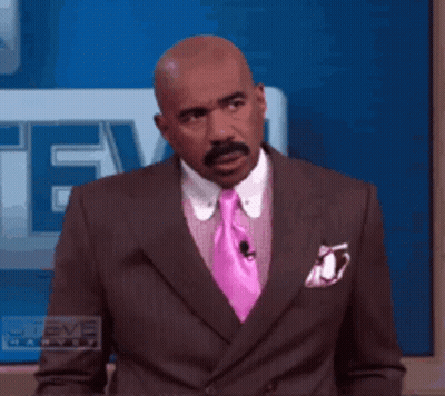 Man In Suit And Pink Tie In Front Of Steve TV GIF