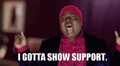 Man In Suit And Red Hat Saying I Gotta Show Support GIF