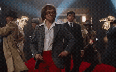 Man In Suit And Red Pants Dancing On Red Carpet GIF