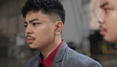 Man In Suit And Red Shirt Looking At Mirror Reflection GIF