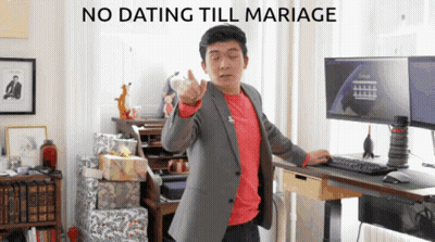 Man in Suit and Red Shirt With No Dating Till Marriage