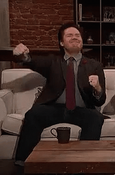 Man In Suit And Red Tie Dancing In Crowd GIF