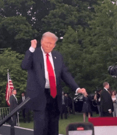 Man In Suit And Red Tie Dancing In Front Of Crowd GIF