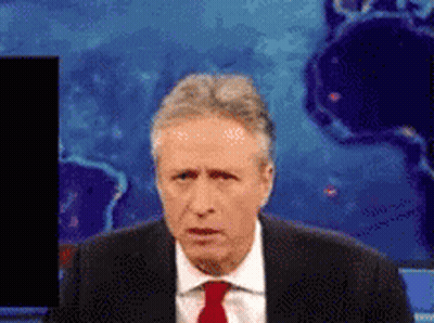 Man In Suit And Red Tie In Front Of World Map GIF