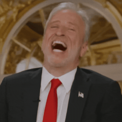 Man In Suit And Red Tie Laughing GIF
