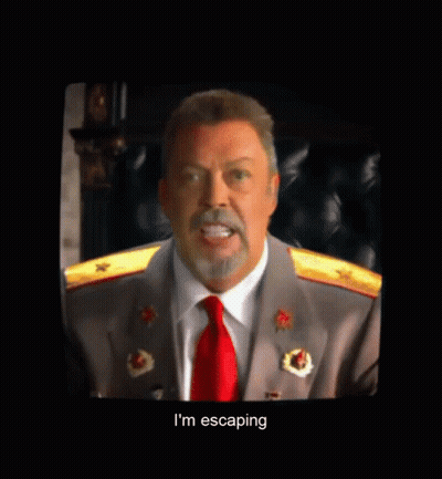 Man In Suit And Red Tie Talking To The One Place GIF