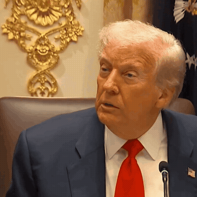 Man In Suit And Red Tie With American Flag GIF