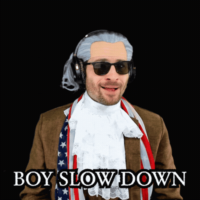 Man In Suit And Scarf Wearing Sunglasses And Headphones GIF