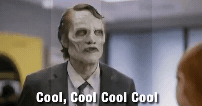 Man In Suit And Skeleton Mask Talking GIF