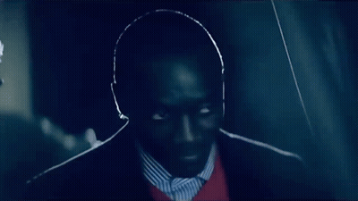 Man In Suit And Striped Shirt Looking GIF